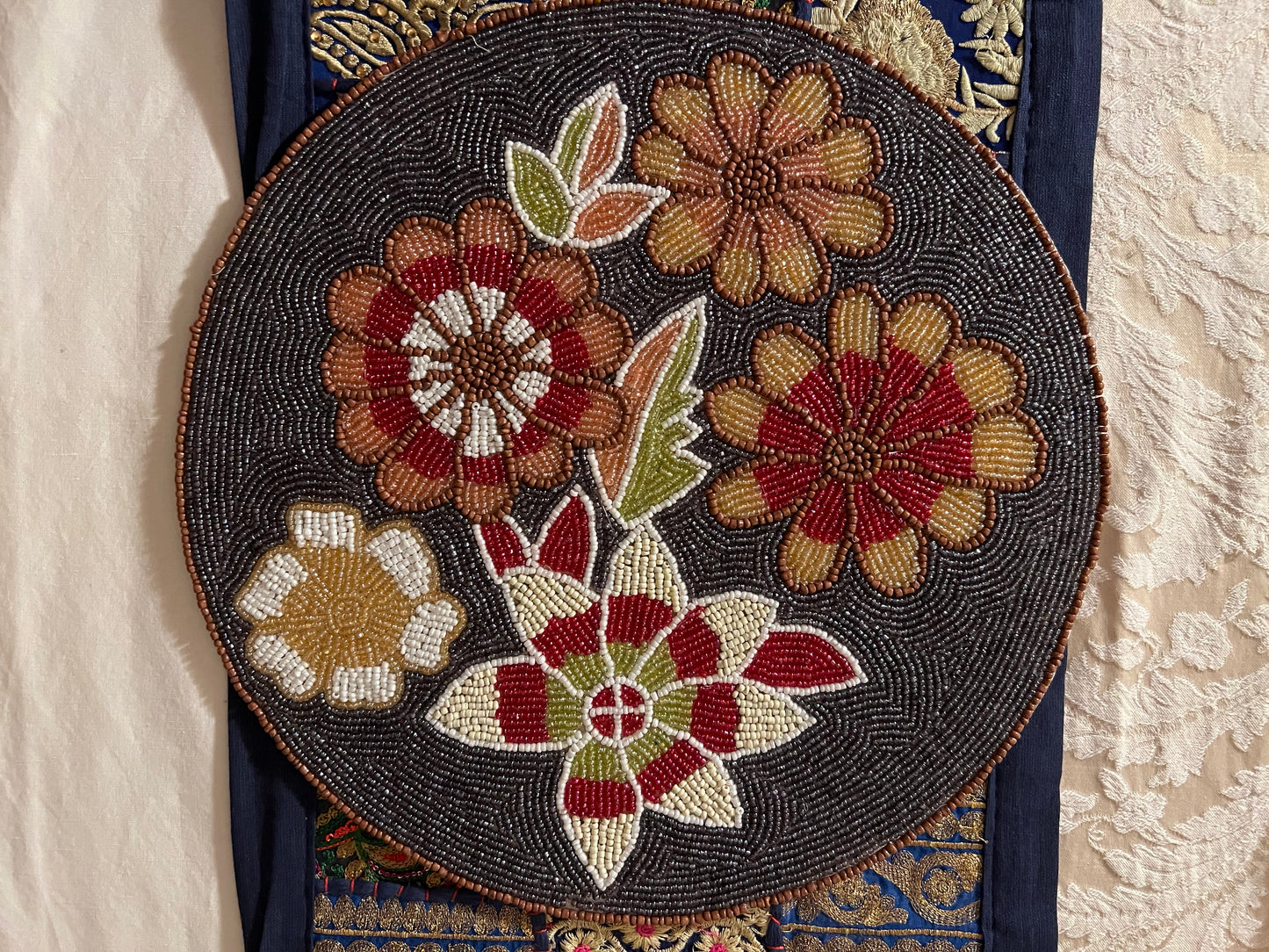 Handcrafted beadwork accent placemats and chargers, featuring intricate designs and vibrant colors, adding a touch of elegance and artistry to your table setting.