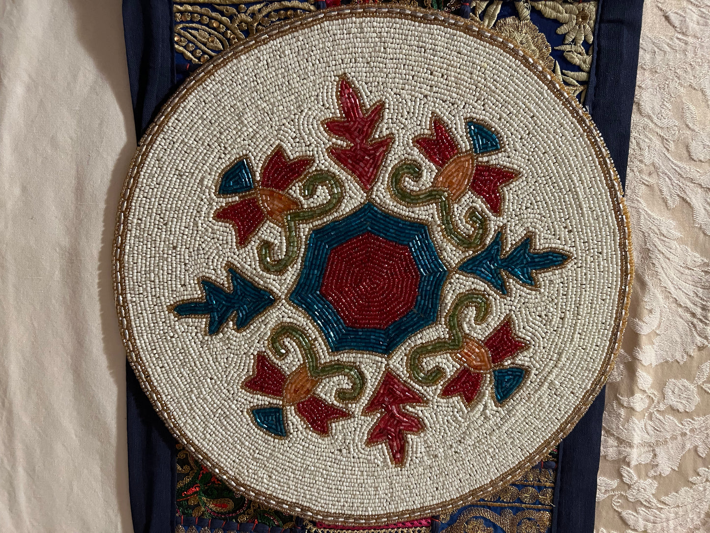 Handcrafted beadwork accent placemats and chargers, featuring intricate designs and vibrant colors, adding a touch of elegance and artistry to your table setting.