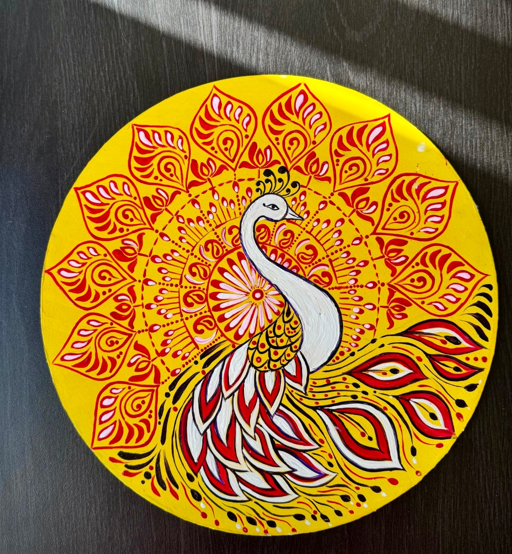 Hand-painted Alpona wall decor plate featuring intricate traditional motifs inspired by Bengali folk art. A stunning blend of cultural heritage and craftsmanship to elevate your home decor.