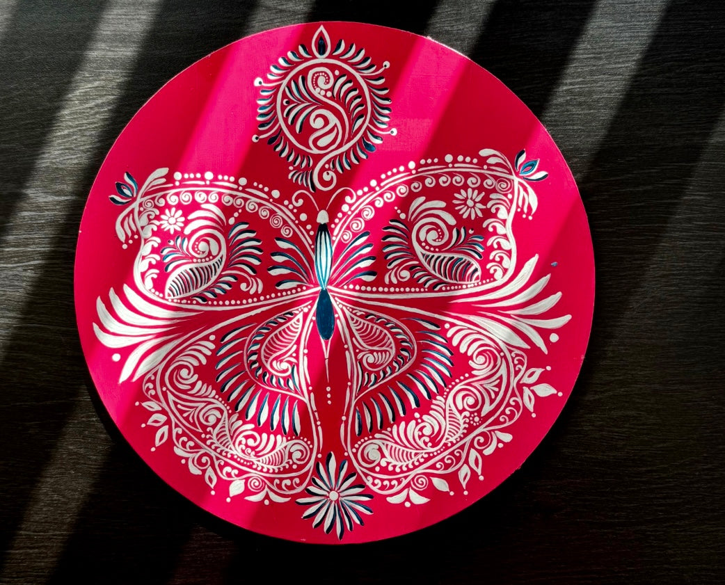 Hand-painted Alpona wall decor plate featuring intricate traditional motifs inspired by Bengali folk art. A stunning blend of cultural heritage and craftsmanship to elevate your home decor.