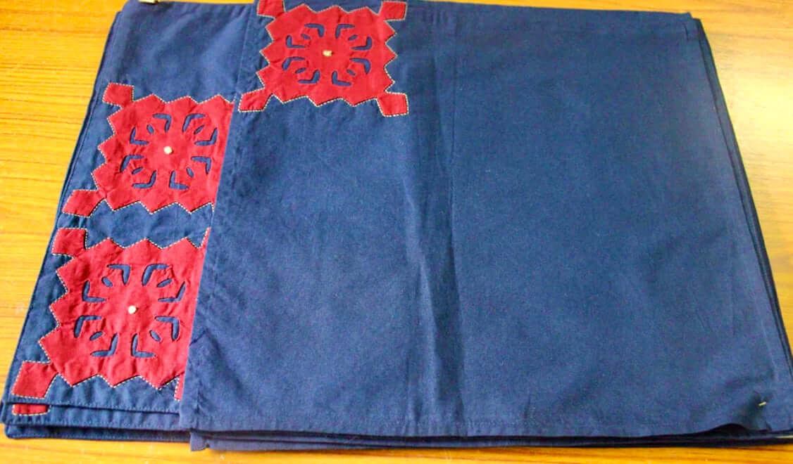 Handcrafted Appliqué work on placemats and napkins set, featuring intricate designs and vibrant colors. A beautiful fusion of traditional craftsmanship and modern elegance to enhance your dining experience.