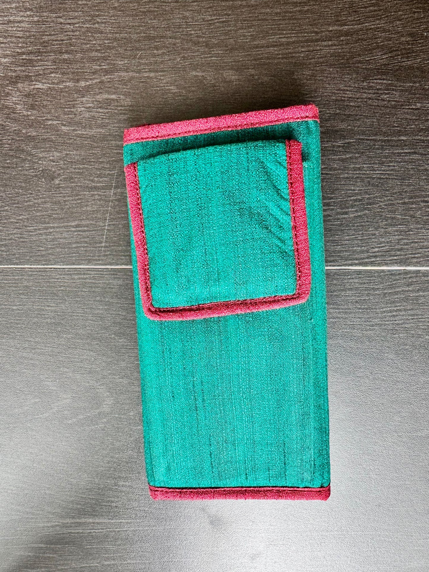 Authentic Kalamkari fabric evening clutch featuring vibrant hand-painted Indian motifs and artisanal detailing.