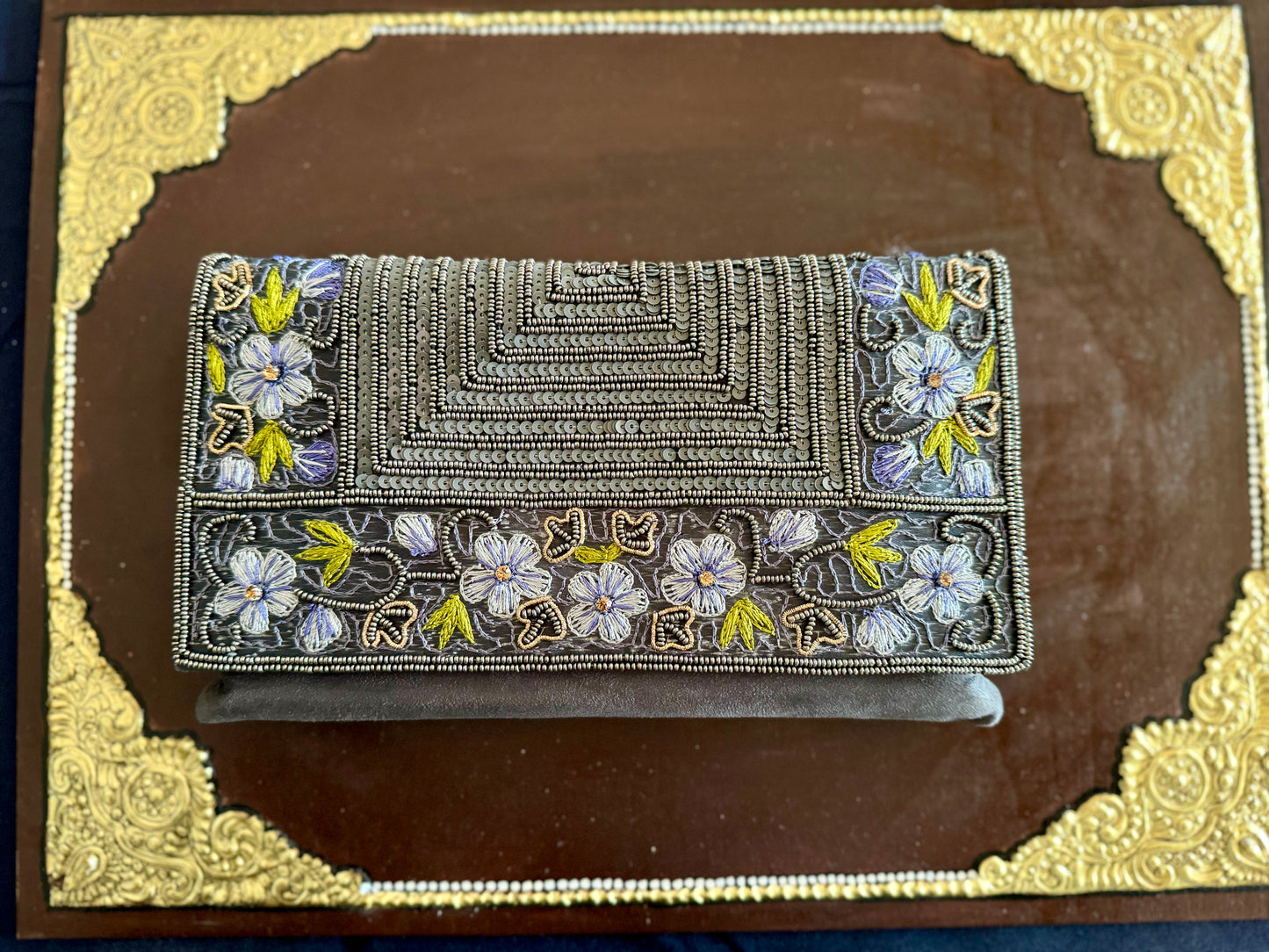 Exquisite beadwork evening clutches and purses, featuring intricate designs and vibrant colors, perfect for adding elegance to any occasion.