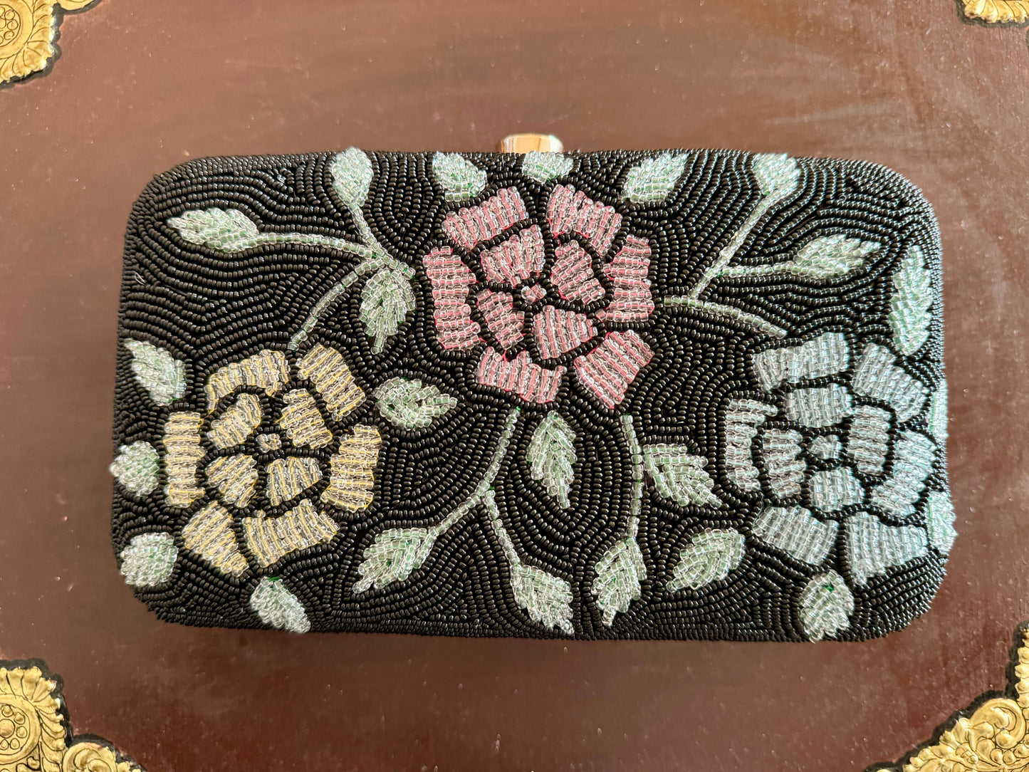 Exquisite beadwork evening clutches and purses, featuring intricate designs and vibrant colors, perfect for adding elegance to any occasion.