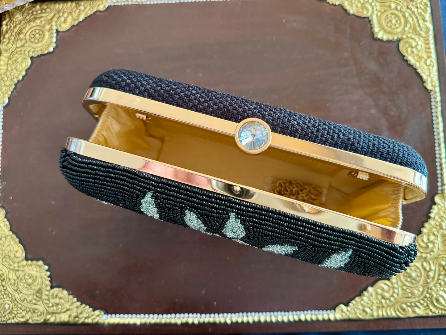 Exquisite beadwork evening clutches and purses, featuring intricate designs and vibrant colors, perfect for adding elegance to any occasion.