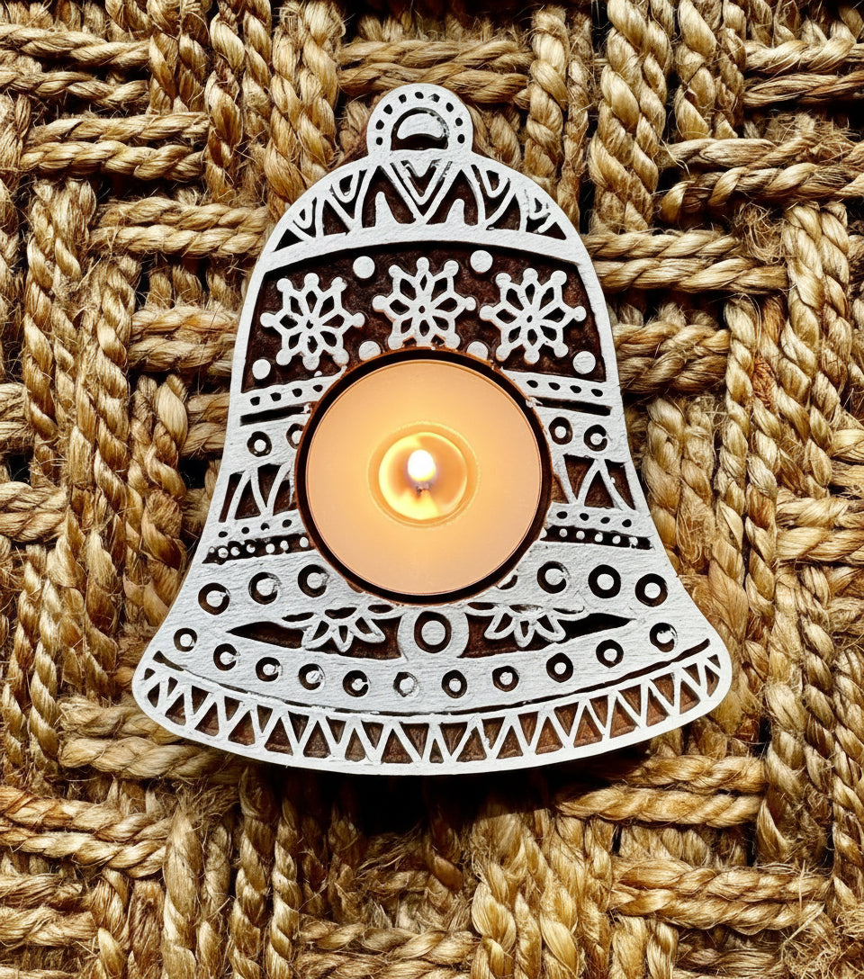 Decorative bell-shaped object with intricate patterns on a woven background
