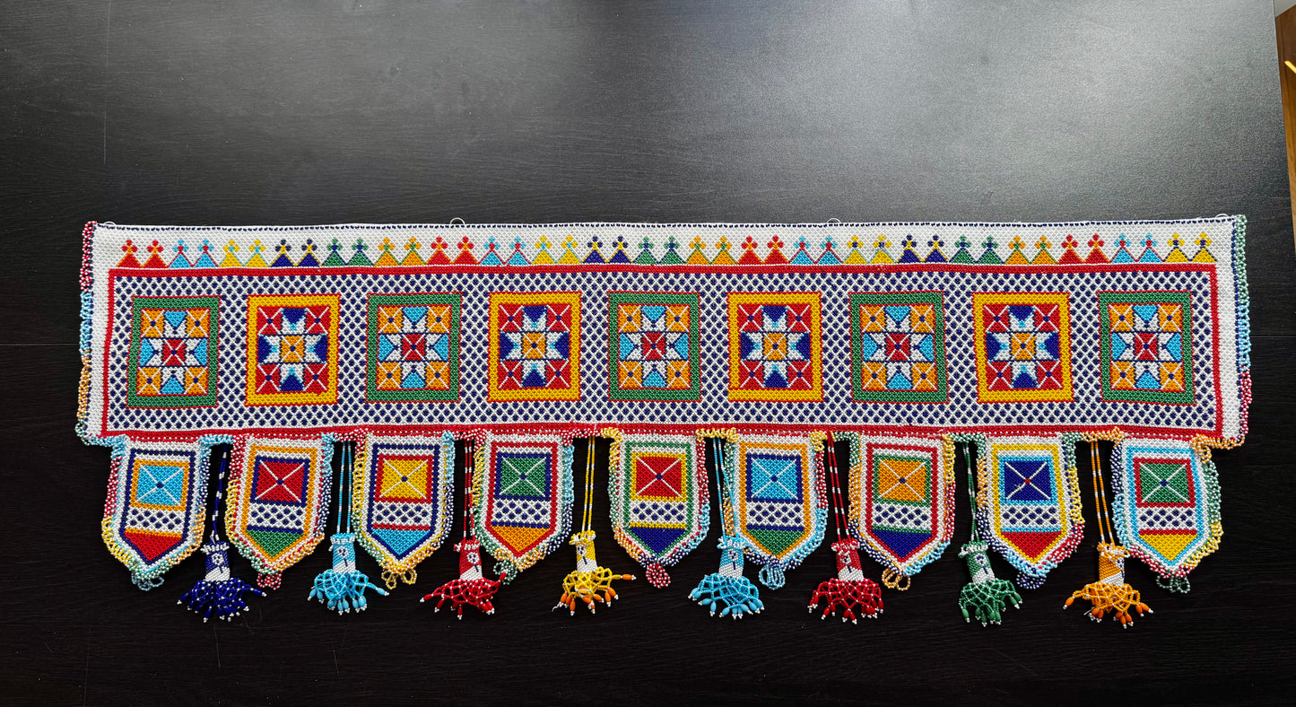 Colorful Motikaam strung pearls art wall/doorway hanging with geometric patterns on a black background