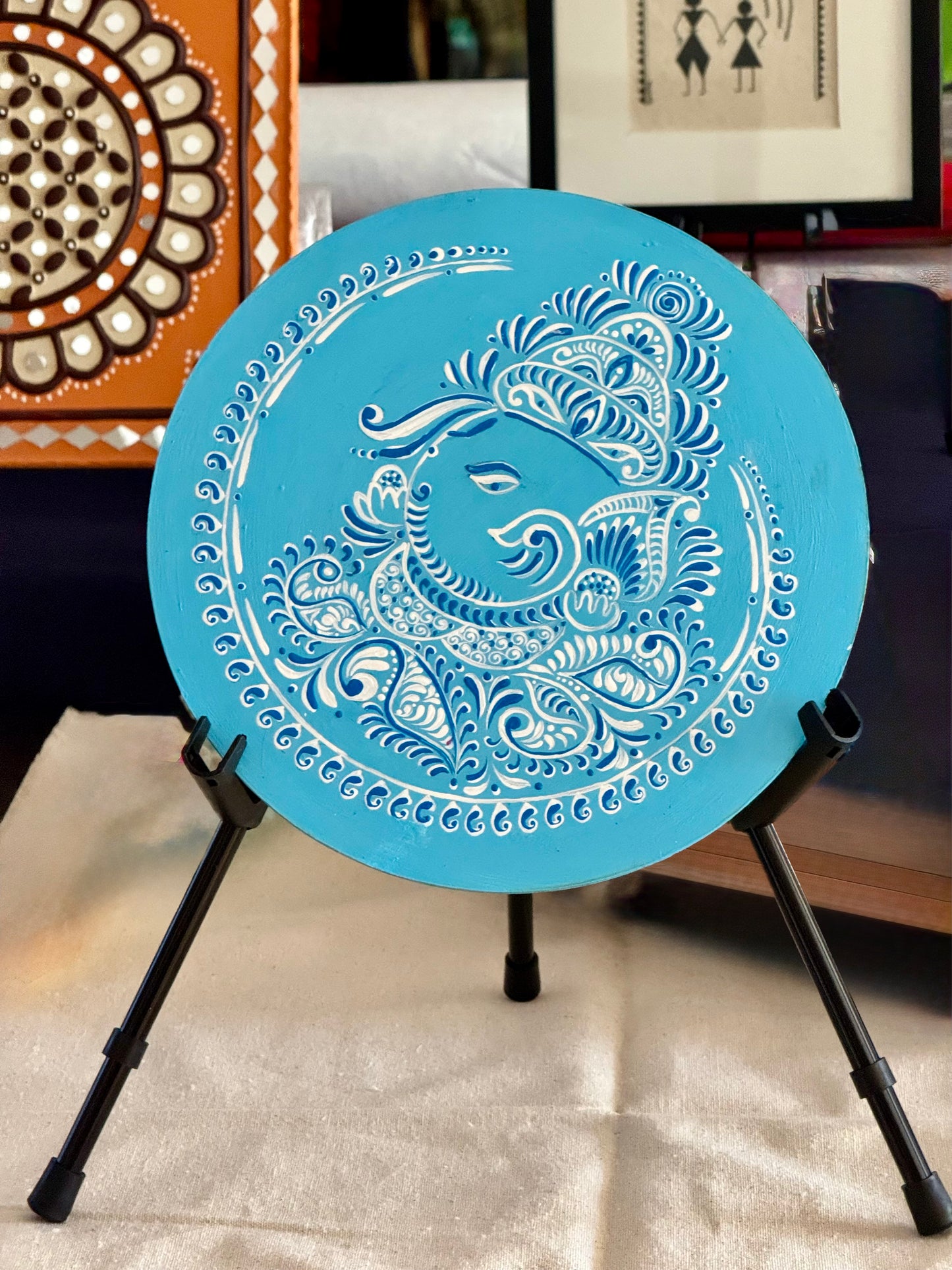 Hand-painted Alpona wall decor plate featuring intricate traditional motifs inspired by Bengali folk art. A stunning blend of cultural heritage and craftsmanship to elevate your home decor.