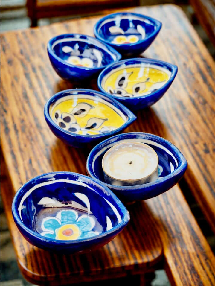 Handcrafted Jaipur Blue Pottery diyas, featuring intricate patterns and vibrant blue tones, perfect for adding a traditional Indian touch to your festive celebrations.