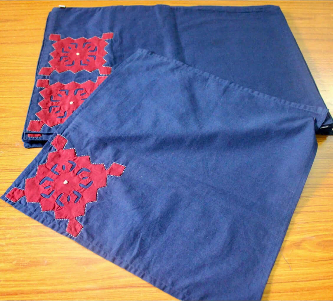 Handcrafted Appliqué work on placemats and napkins set, featuring intricate designs and vibrant colors. A beautiful fusion of traditional craftsmanship and modern elegance to enhance your dining experience.