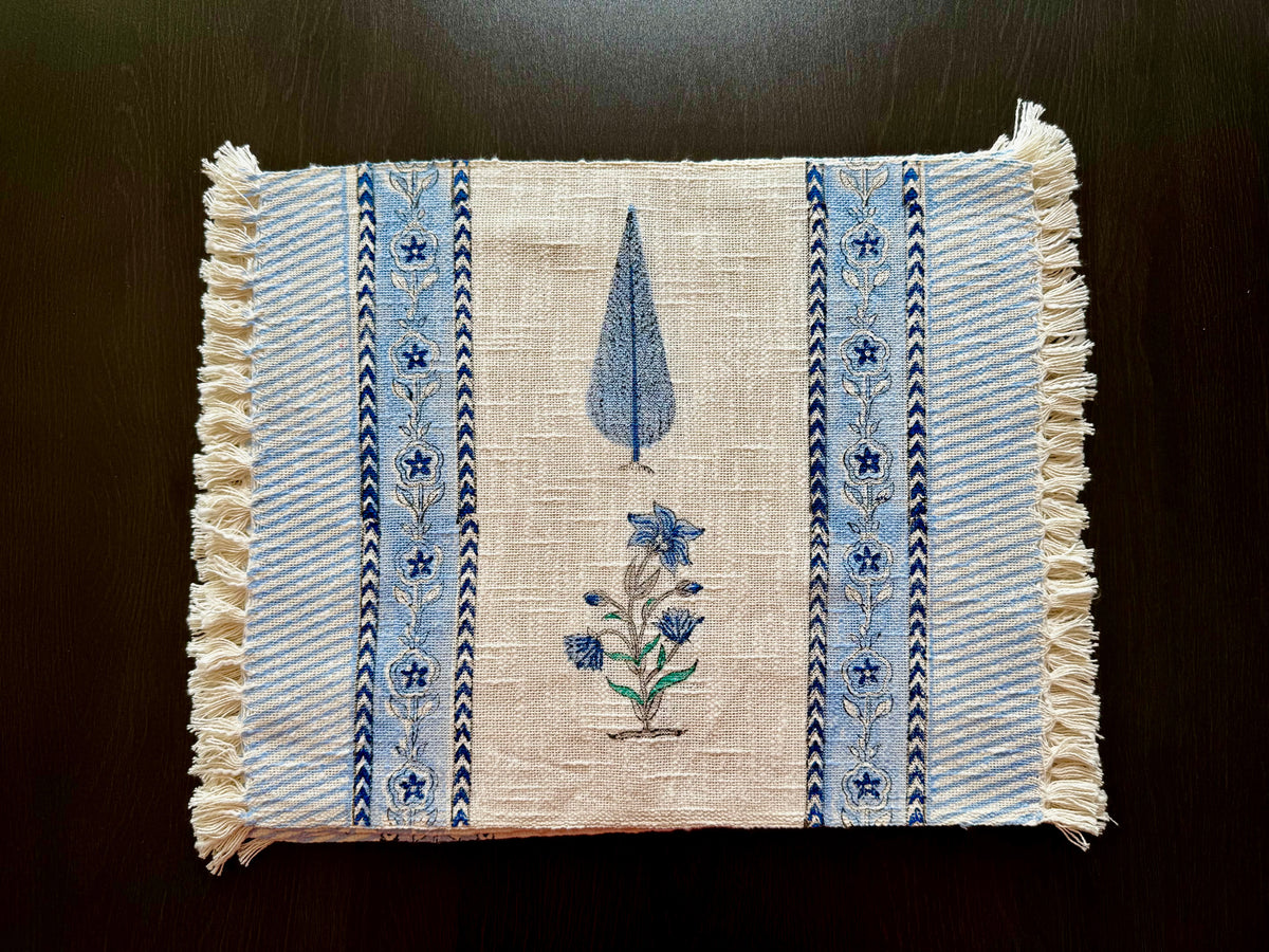 Placemats with blue floral hand block print on a dark background