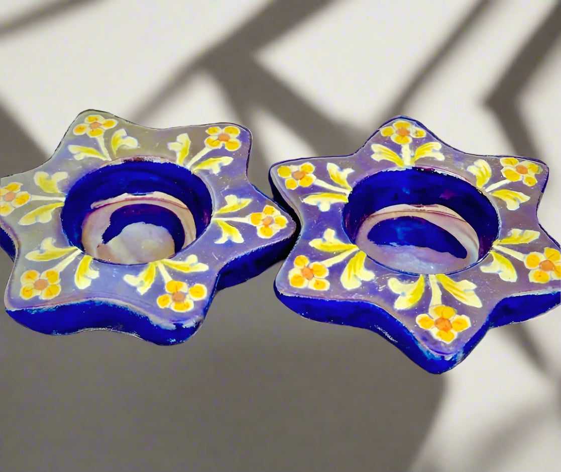 Handcrafted Jaipur Blue Pottery tea light holders, featuring intricate designs and vibrant blue hues, adding a traditional Indian touch to your home decor.