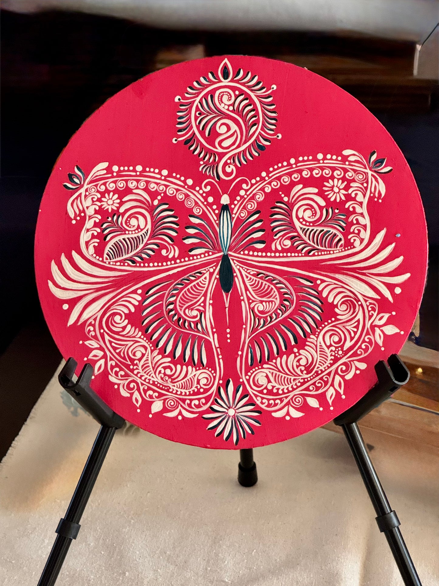 Hand-painted Alpona wall decor plate featuring intricate traditional motifs inspired by Bengali folk art. A stunning blend of cultural heritage and craftsmanship to elevate your home decor.
