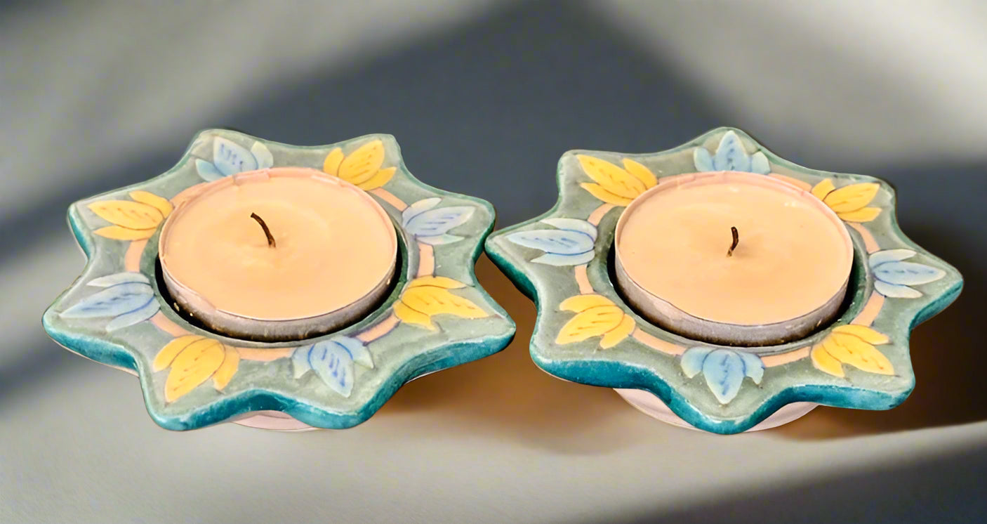 Handcrafted Jaipur Blue Pottery tea light holders, featuring intricate designs and vibrant blue hues, adding a traditional Indian touch to your home decor.