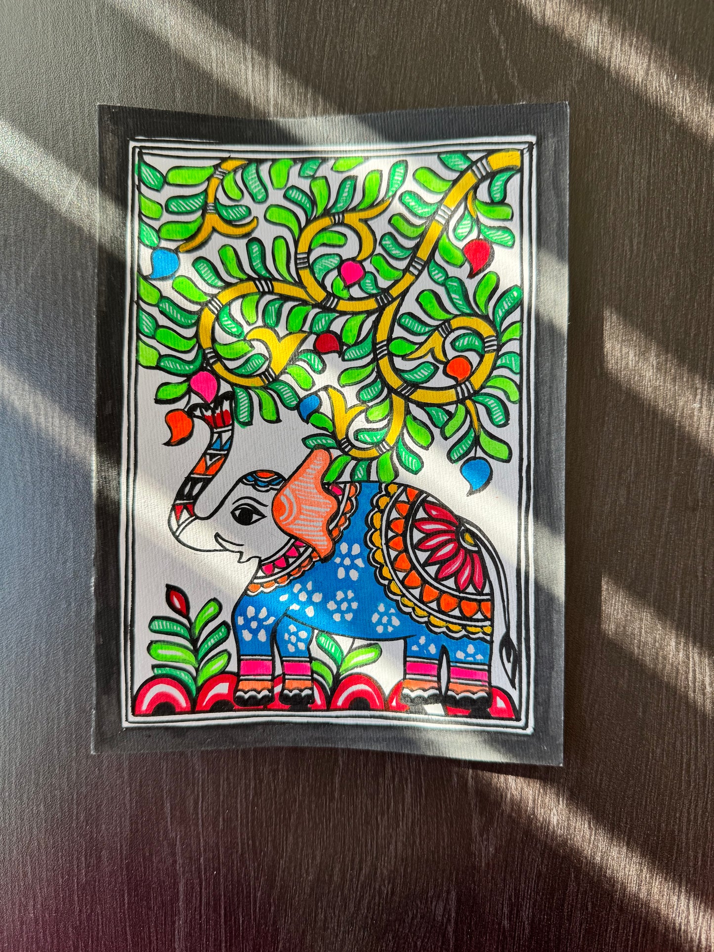 Colorful abstract artwork on a wooden surface