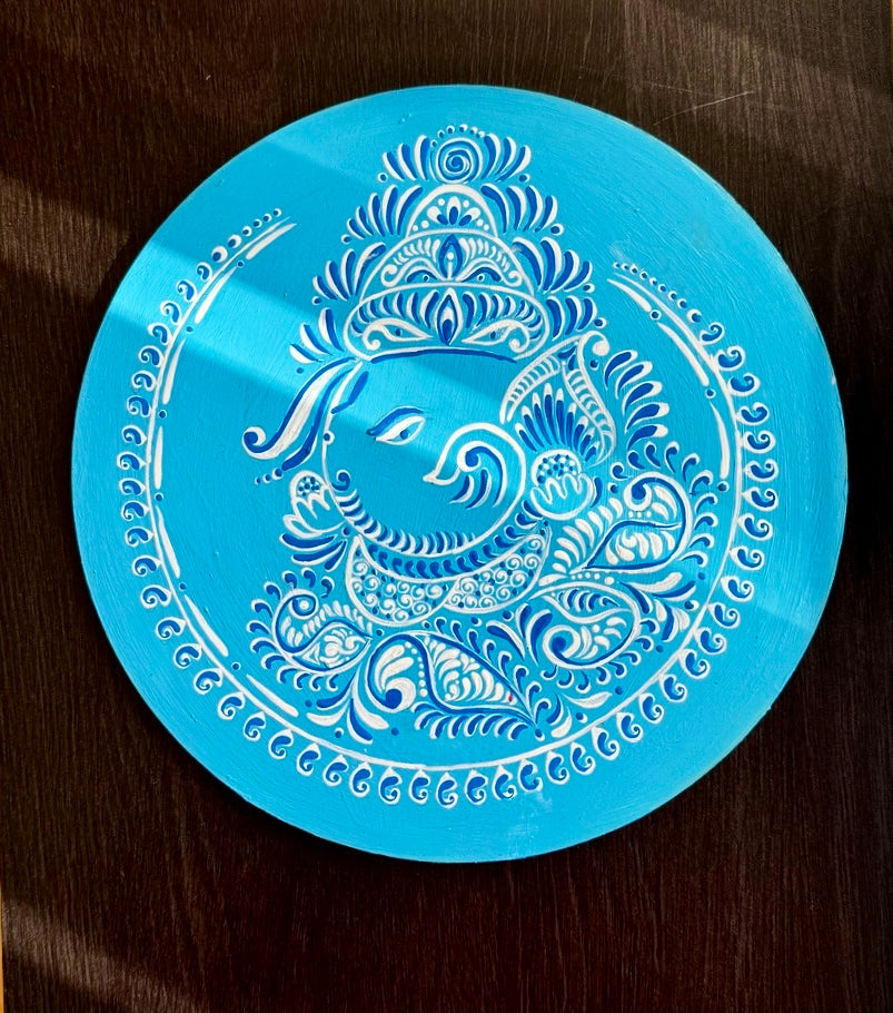 Hand-painted Alpona wall decor plate featuring intricate traditional motifs inspired by Bengali folk art. A stunning blend of cultural heritage and craftsmanship to elevate your home decor.