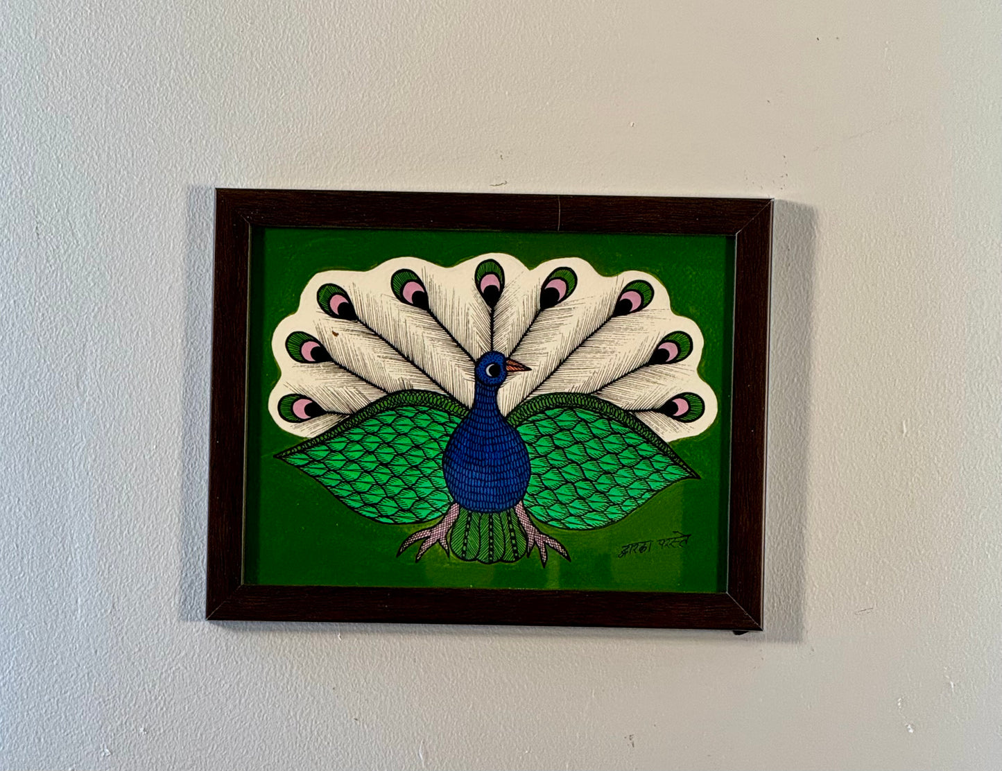 Hand-painted Gond art wall decor featuring intricate tribal patterns and vibrant storytelling inspired by nature and folklore.
