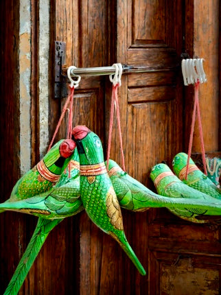 Exquisite Pattachitra art hand-painted on decorative items like Suparis, coconut balls, tea kettles, small Kulo baskets, and miniature mandirs. A vibrant showcase of intricate craftsmanship and cultural heritage for unique home decor.