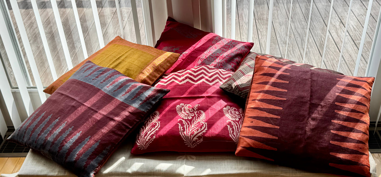 Silk cushion cover with intricate hand block print design, featuring traditional patterns and rich colors on a smooth, lustrous fabric