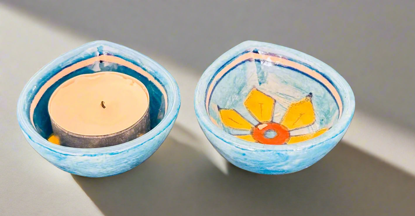 Handcrafted Jaipur Blue Pottery diyas, featuring intricate patterns and vibrant blue tones, perfect for adding a traditional Indian touch to your festive celebrations.