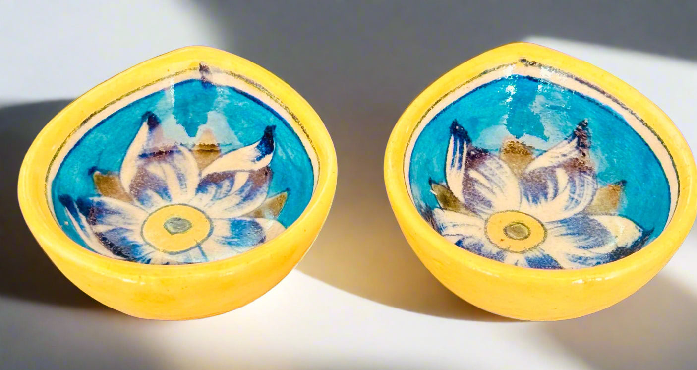 Handcrafted Jaipur Blue Pottery diyas, featuring intricate patterns and vibrant blue tones, perfect for adding a traditional Indian touch to your festive celebrations.