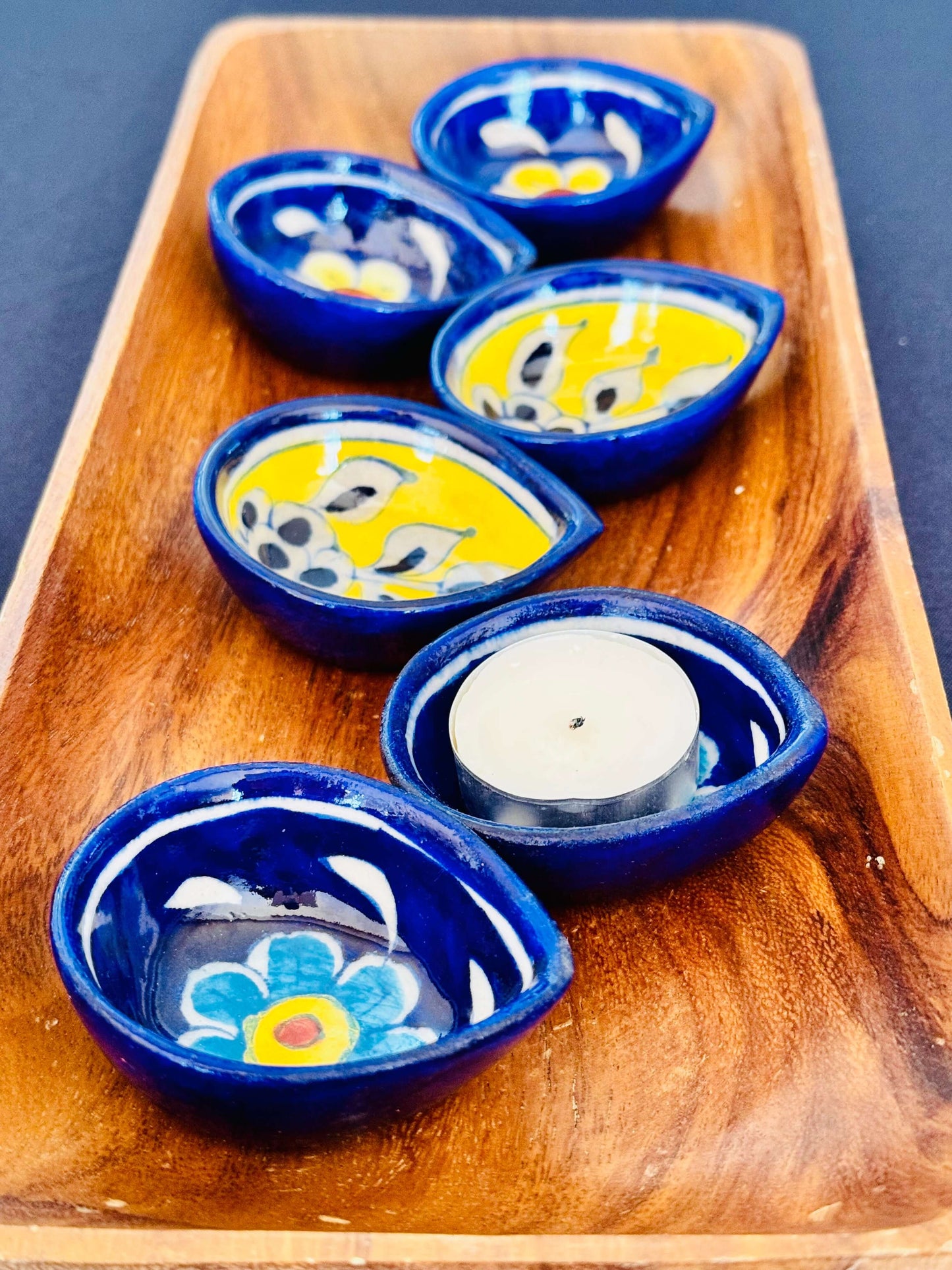 Handcrafted Jaipur Blue Pottery diyas, featuring intricate patterns and vibrant blue tones, perfect for adding a traditional Indian touch to your festive celebrations.