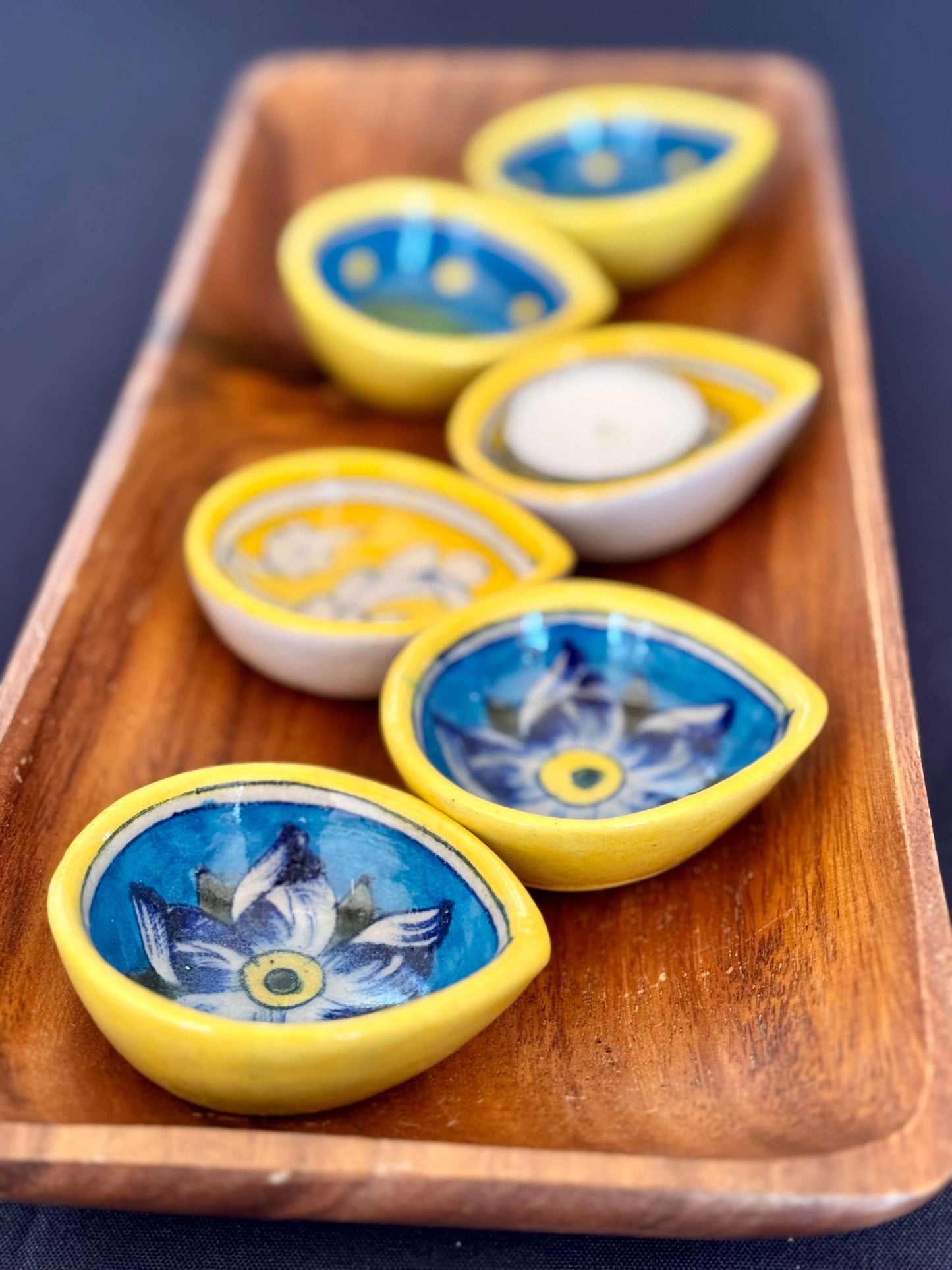 Handcrafted Jaipur Blue Pottery diyas, featuring intricate patterns and vibrant blue tones, perfect for adding a traditional Indian touch to your festive celebrations.