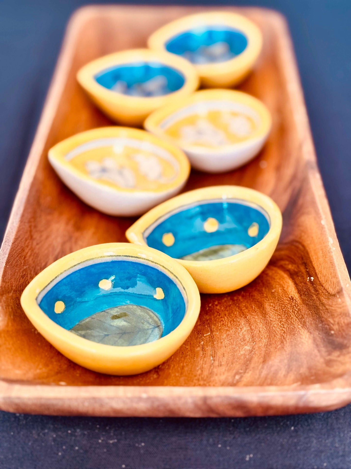 Handcrafted Jaipur Blue Pottery diyas, featuring intricate patterns and vibrant blue tones, perfect for adding a traditional Indian touch to your festive celebrations.
