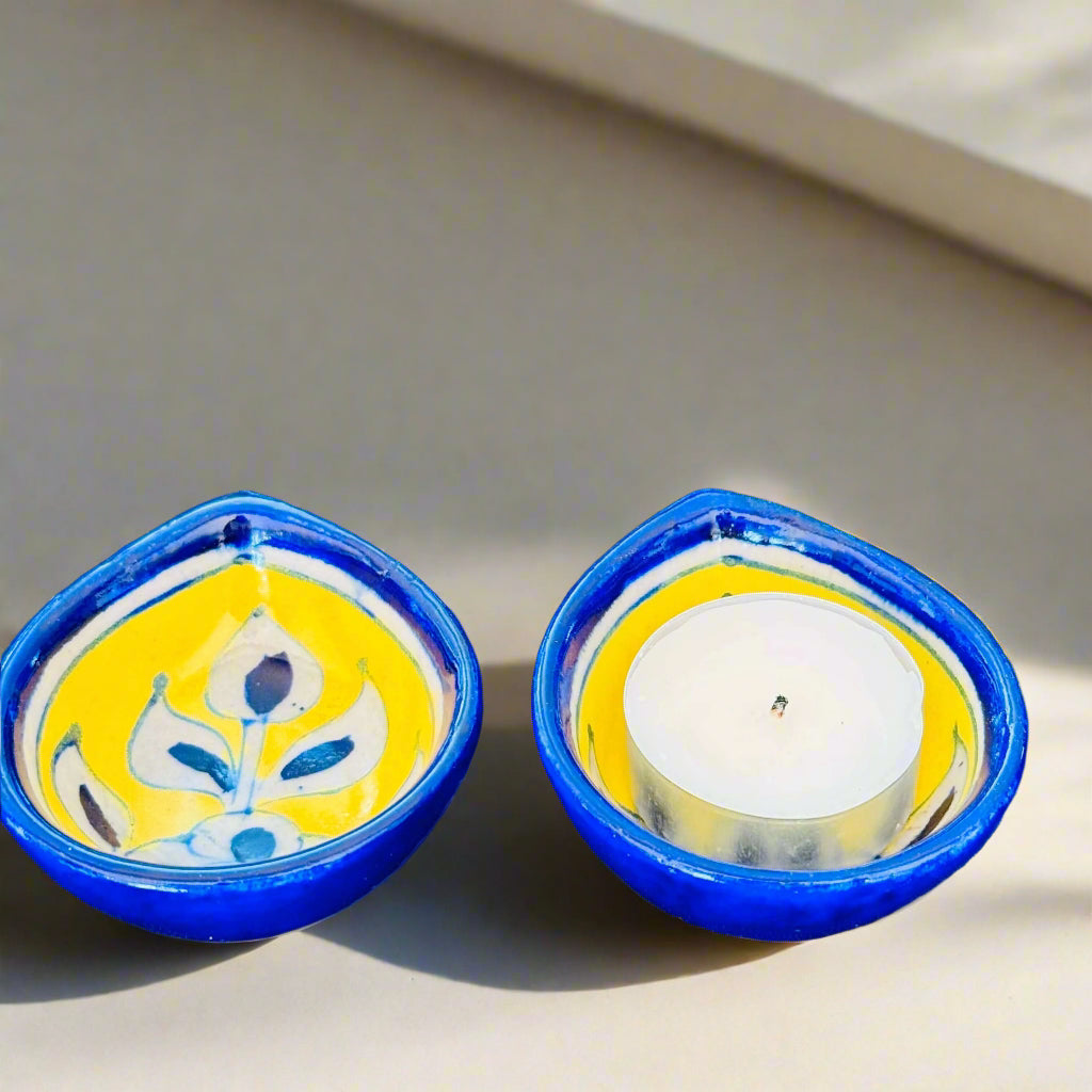 Handcrafted Jaipur Blue Pottery diyas, featuring intricate patterns and vibrant blue tones, perfect for adding a traditional Indian touch to your festive celebrations.