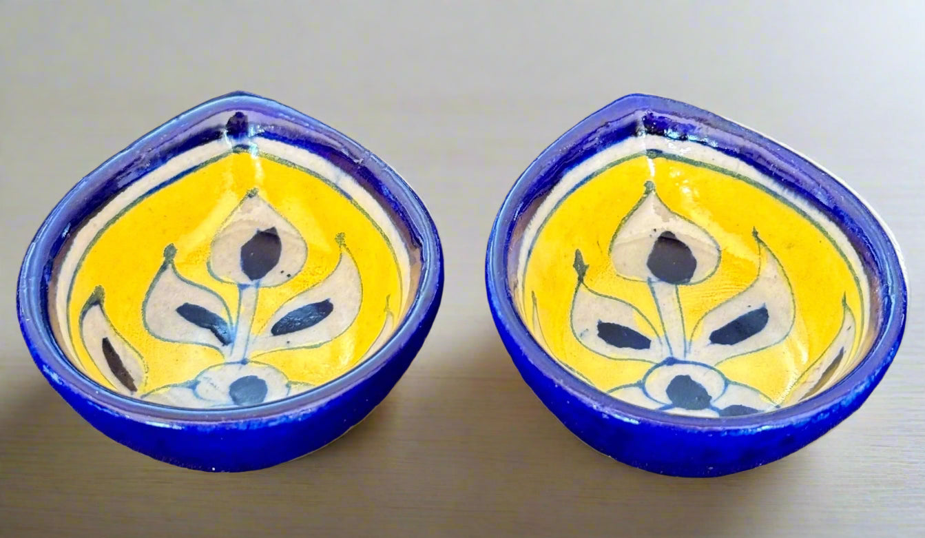 Handcrafted Jaipur Blue Pottery diyas, featuring intricate patterns and vibrant blue tones, perfect for adding a traditional Indian touch to your festive celebrations.