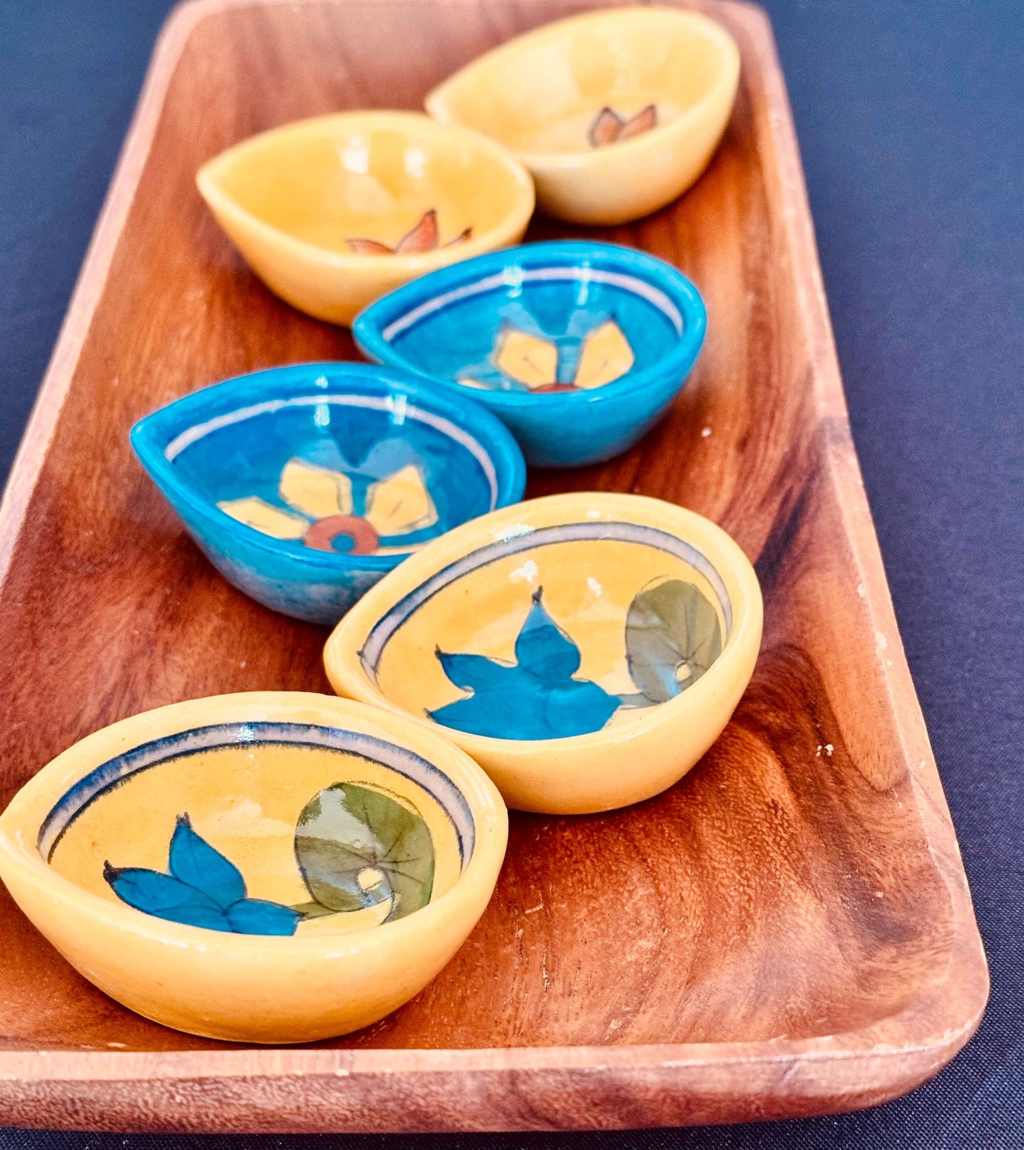 Handcrafted Jaipur Blue Pottery diyas, featuring intricate patterns and vibrant blue tones, perfect for adding a traditional Indian touch to your festive celebrations.