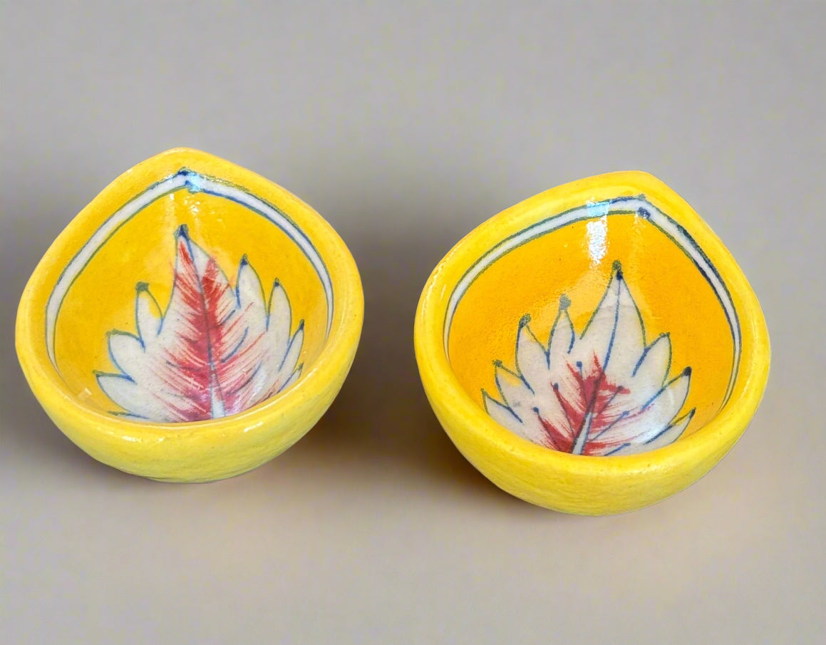 Handcrafted Jaipur Blue Pottery diyas, featuring intricate patterns and vibrant blue tones, perfect for adding a traditional Indian touch to your festive celebrations.