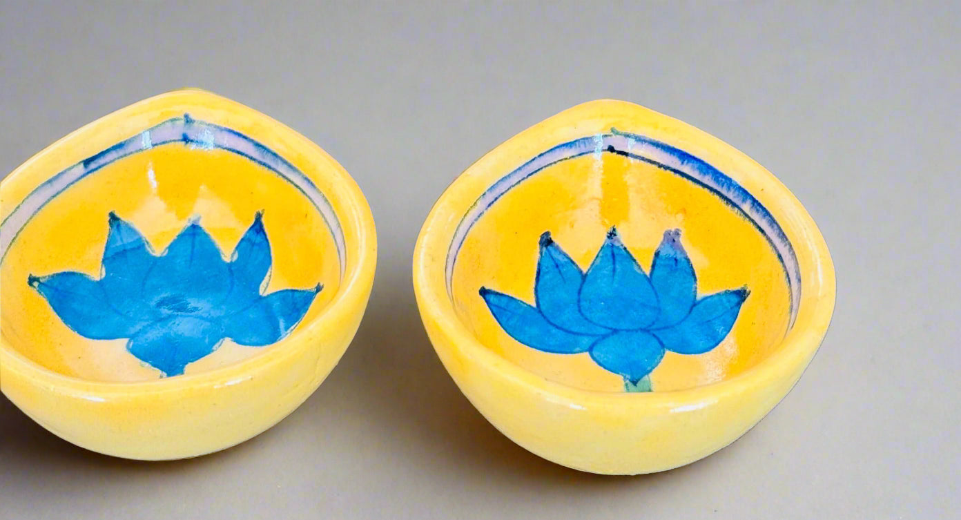Handcrafted Jaipur Blue Pottery diyas, featuring intricate patterns and vibrant blue tones, perfect for adding a traditional Indian touch to your festive celebrations.
