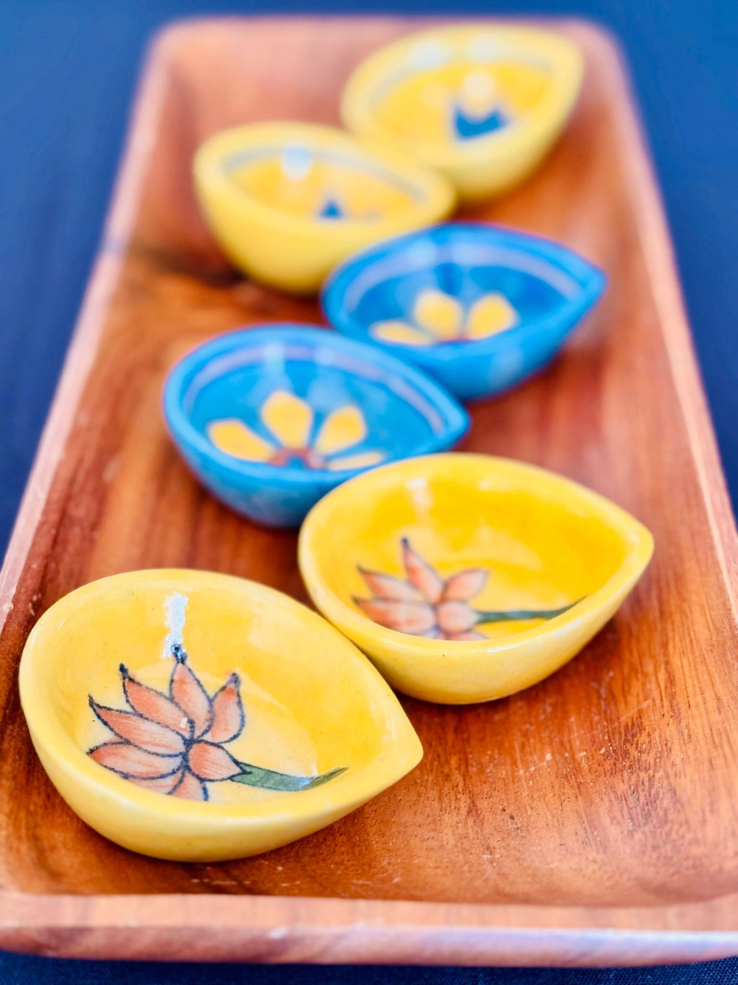 Handcrafted Jaipur Blue Pottery diyas, featuring intricate patterns and vibrant blue tones, perfect for adding a traditional Indian touch to your festive celebrations.