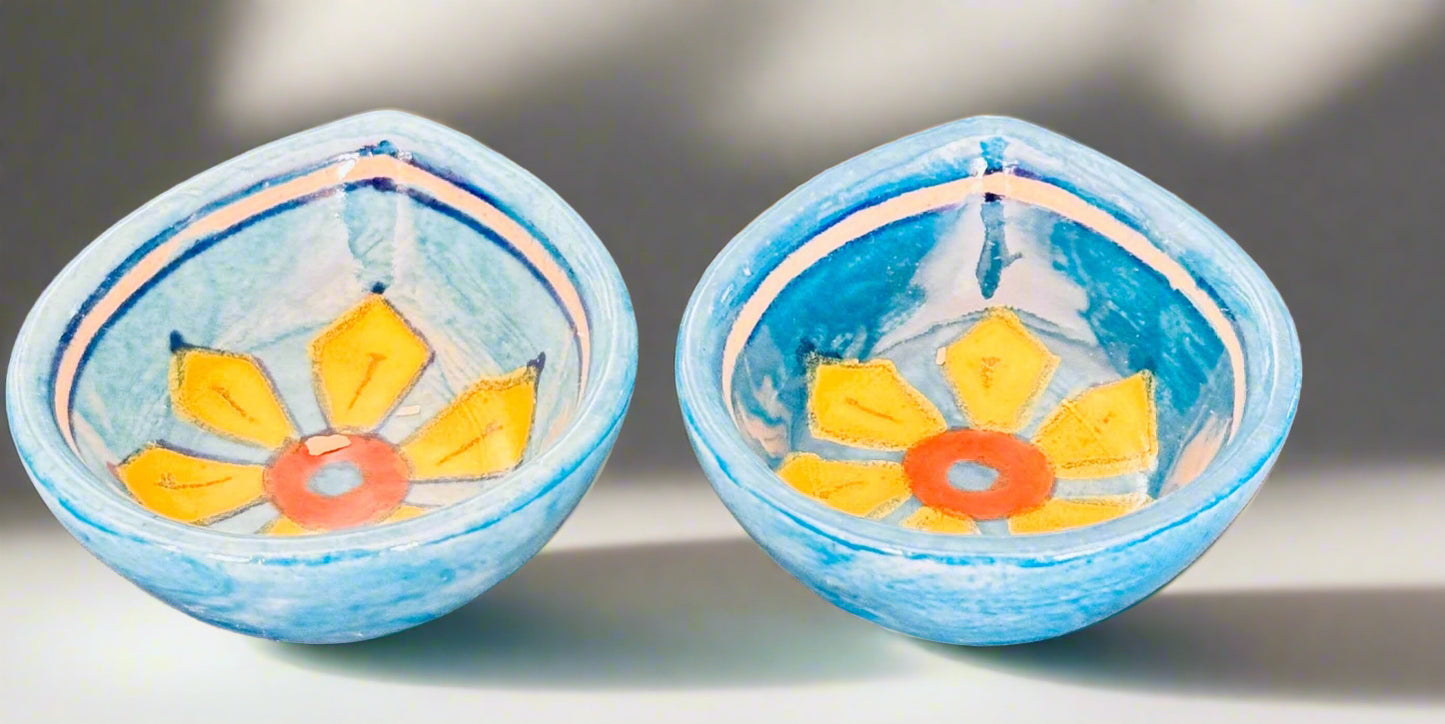 Handcrafted Jaipur Blue Pottery diyas, featuring intricate patterns and vibrant blue tones, perfect for adding a traditional Indian touch to your festive celebrations.