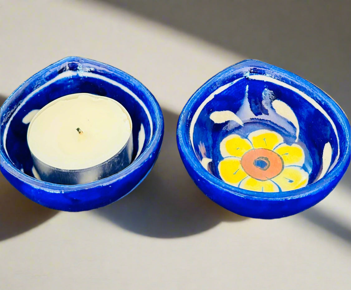 Handcrafted Jaipur Blue Pottery diyas, featuring intricate patterns and vibrant blue tones, perfect for adding a traditional Indian touch to your festive celebrations.