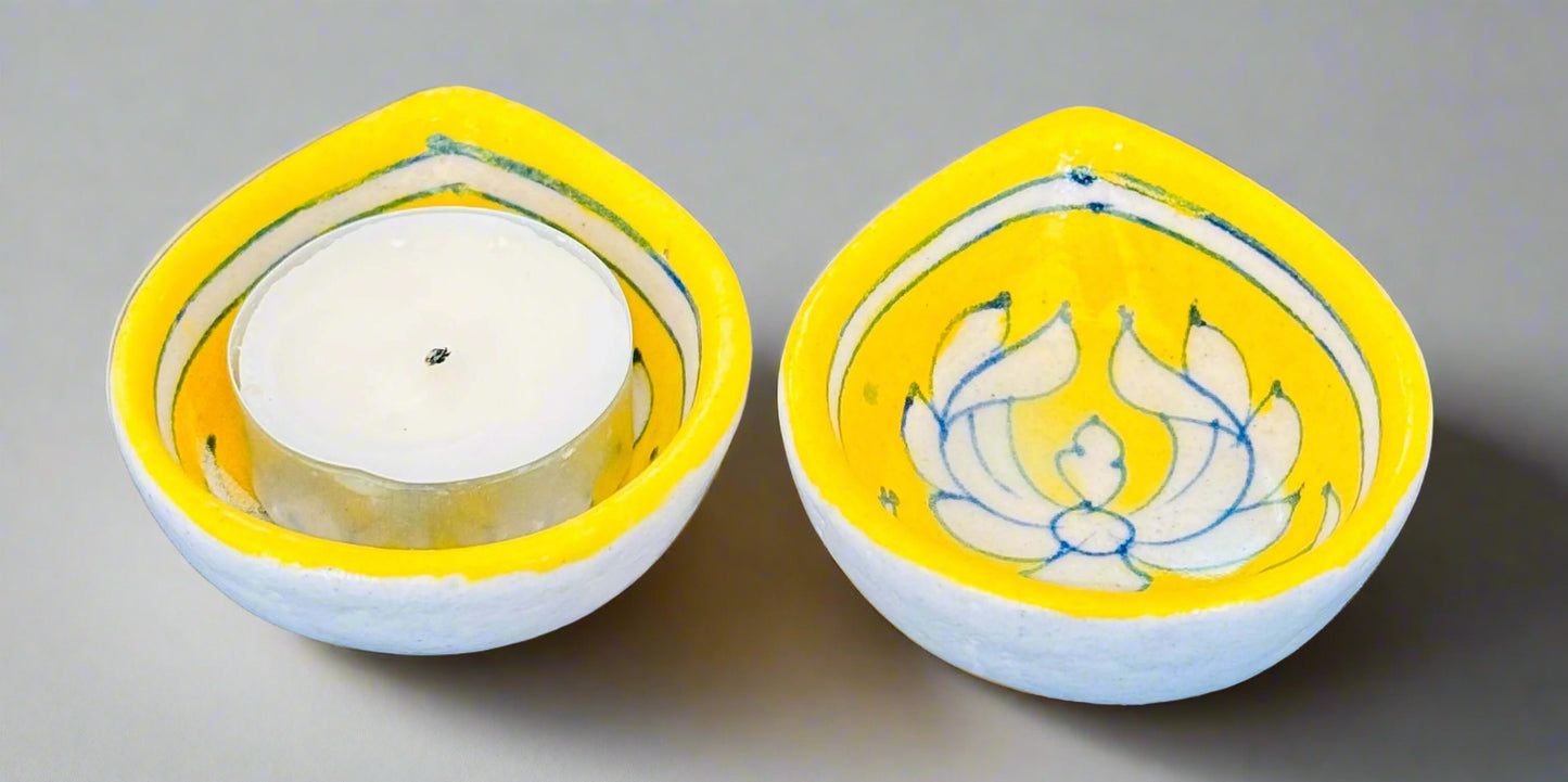 Handcrafted and Jaipur Blue Pottery diyas, featuring intricate patterns and vibrant blue tones, perfect for adding a traditional Indian touch to your festive celebrations.