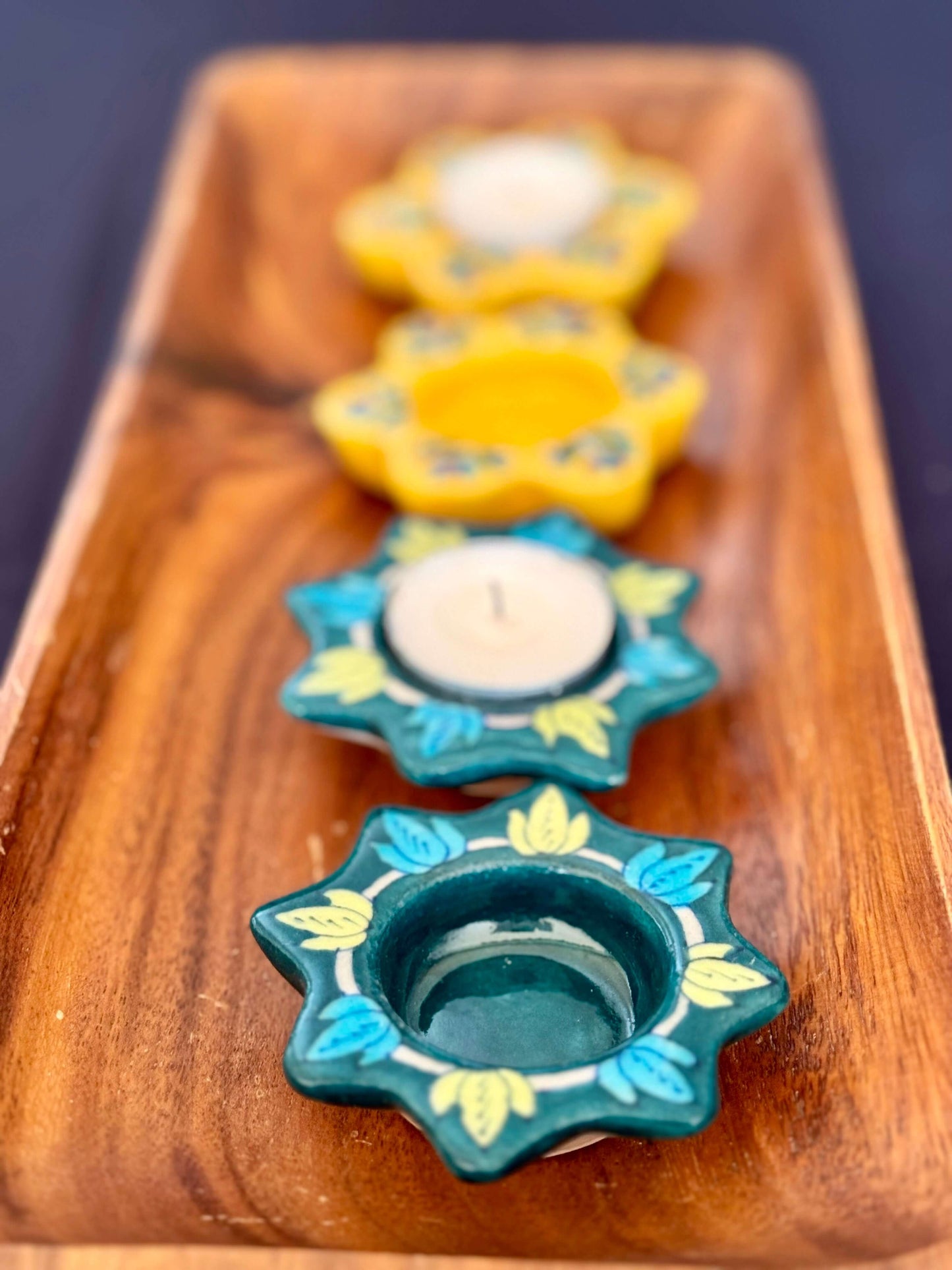 Handcrafted Jaipur Blue Pottery tea light holders, featuring intricate designs and vibrant blue hues, adding a traditional Indian touch to your home decor.