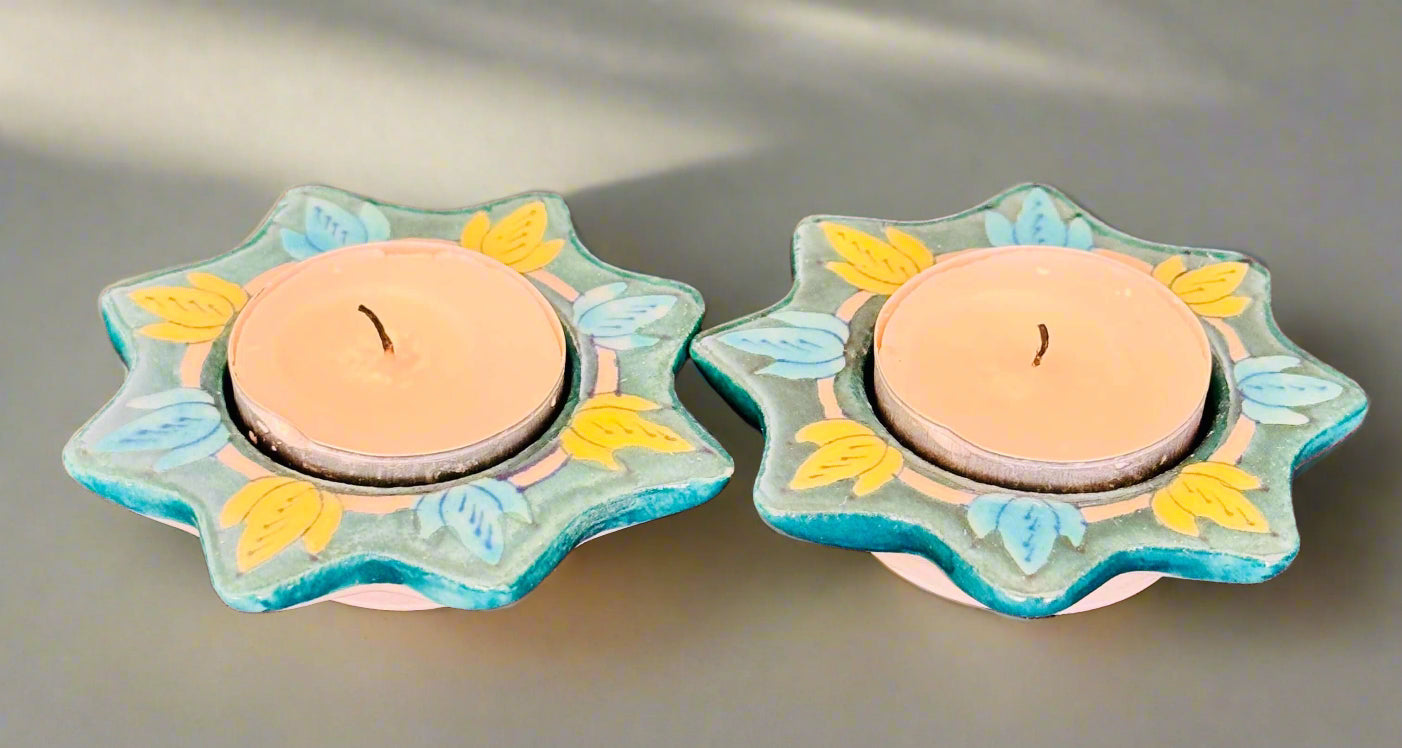Handcrafted Jaipur Blue Pottery tea light holders, featuring intricate designs and vibrant blue hues, adding a traditional Indian touch to your home decor.