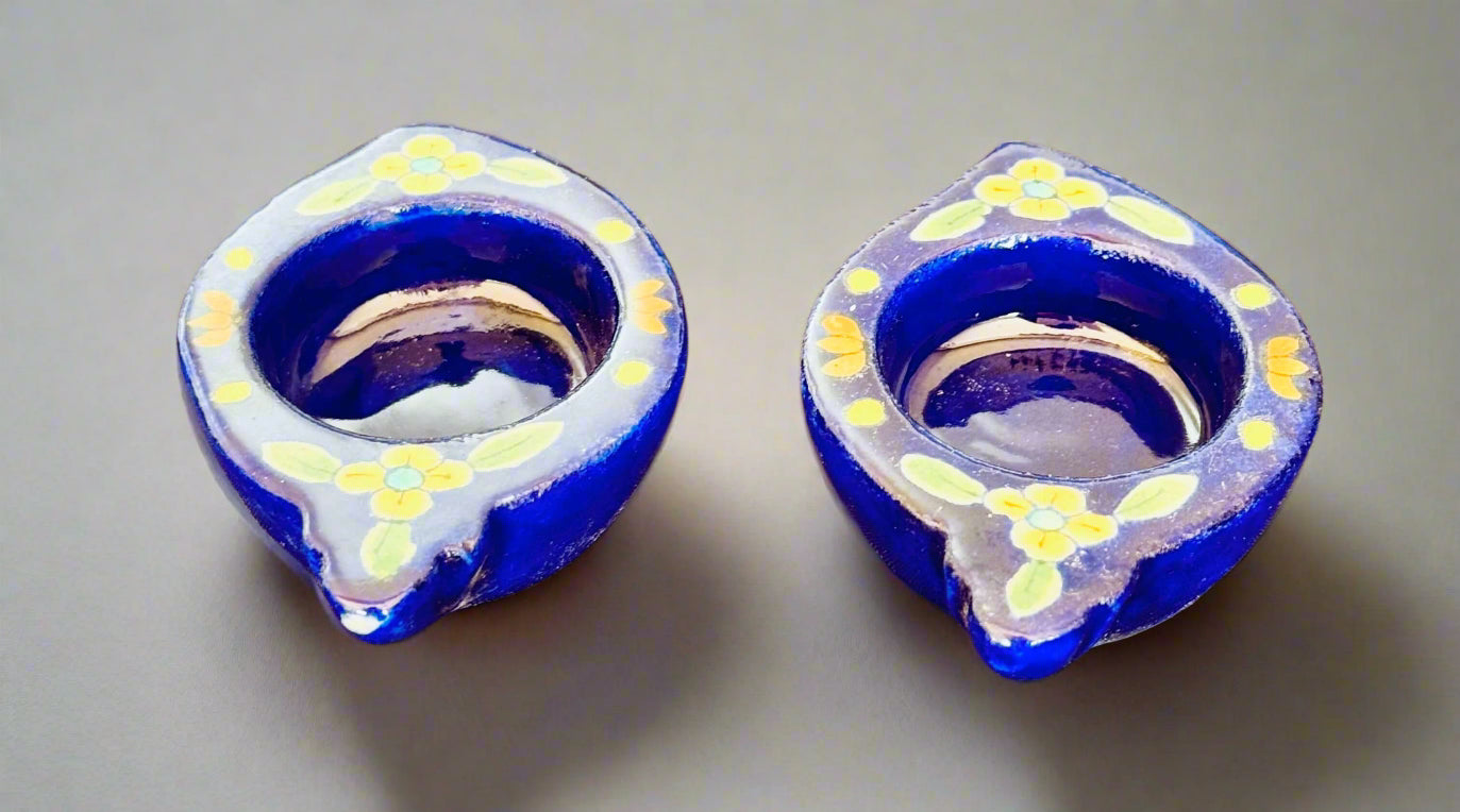 Handcrafted Jaipur Blue Pottery tea light holders, featuring intricate designs and vibrant blue hues, adding a traditional Indian touch to your home decor.