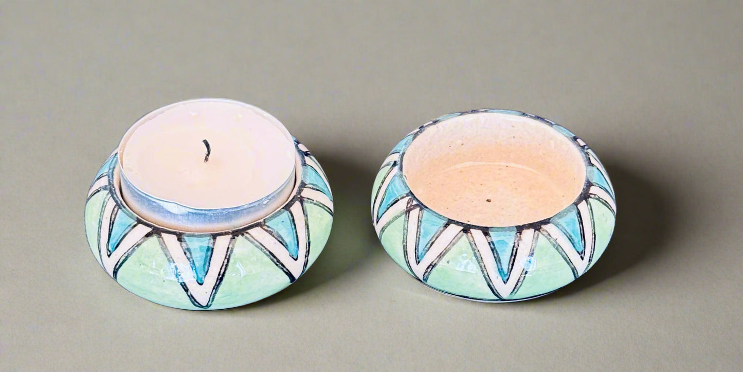 Handcrafted Jaipur Blue Pottery tea light holders, featuring intricate designs and vibrant blue hues, adding a traditional Indian touch to your home decor.