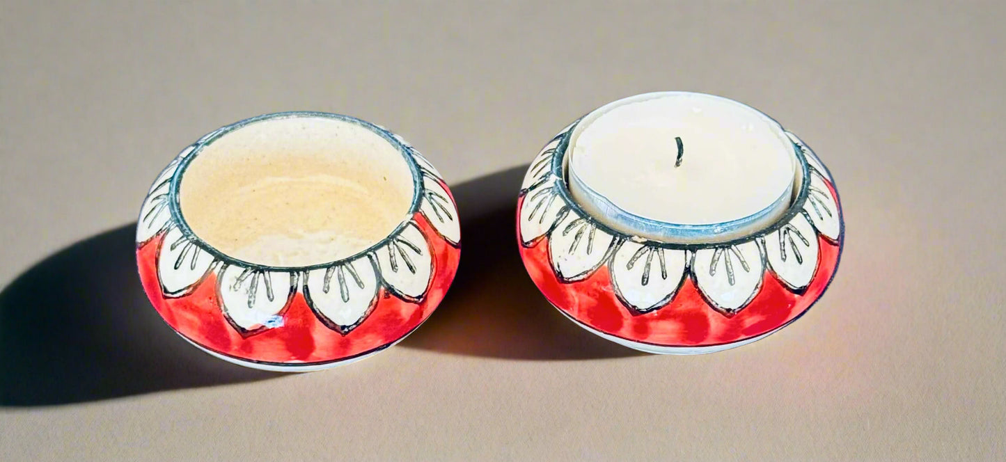 Handcrafted Jaipur Blue Pottery tea light holders, featuring intricate designs and vibrant blue hues, adding a traditional Indian touch to your home decor.