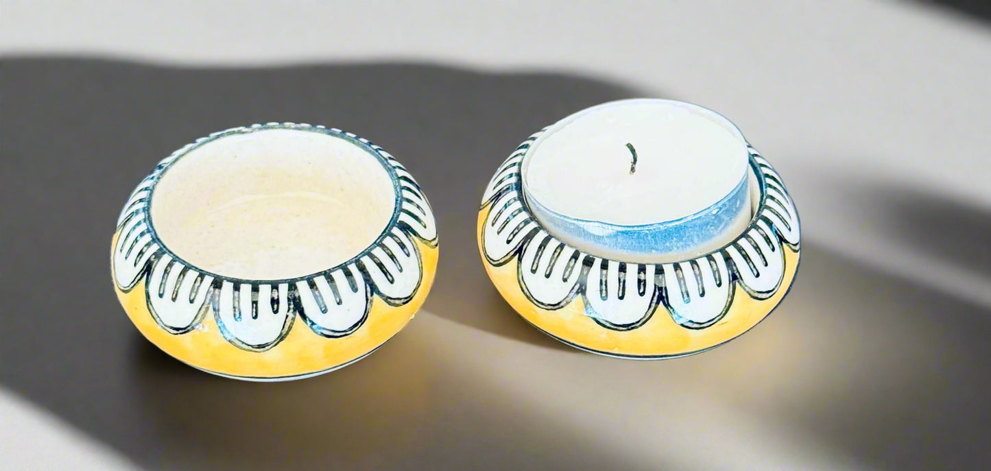 Handcrafted Jaipur Blue Pottery tea light holders, featuring intricate designs and vibrant blue hues, adding a traditional Indian touch to your home decor.