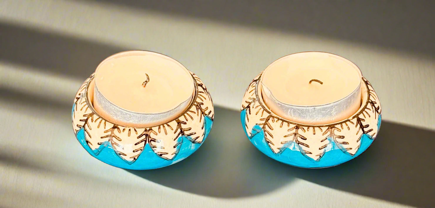 Handcrafted Jaipur Blue Pottery tea light holders, featuring intricate designs and vibrant blue hues, adding a traditional Indian touch to your home decor.