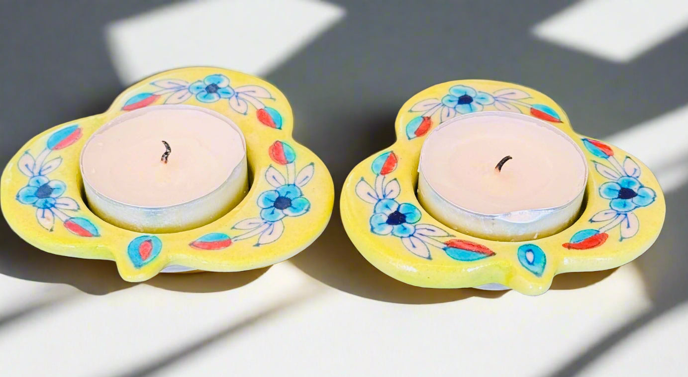 Handcrafted Jaipur Blue Pottery tea light holders, featuring intricate designs and vibrant blue hues, adding a traditional Indian touch to your home decor.