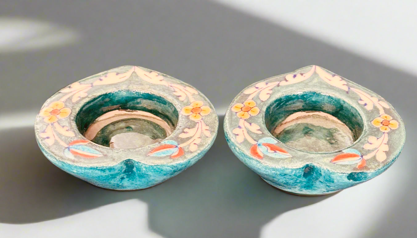 Handcrafted Jaipur Blue Pottery tea light holders, featuring intricate designs and vibrant blue hues, adding a traditional Indian touch to your home decor.