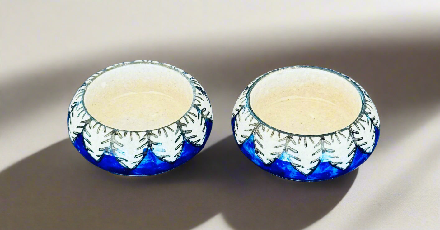 Handcrafted Jaipur Blue Pottery tea light holders, featuring intricate designs and vibrant blue hues, adding a traditional Indian touch to your home decor.