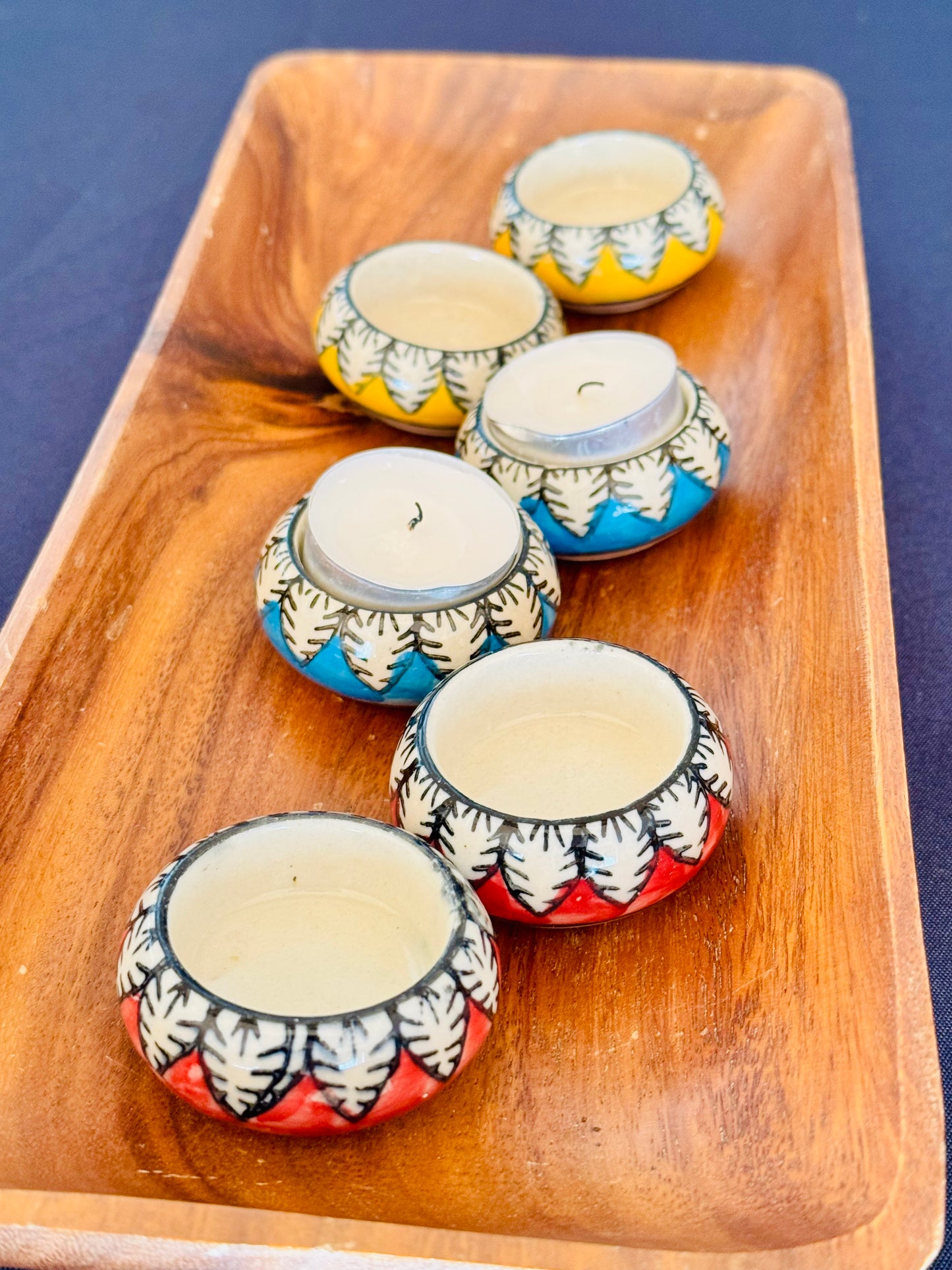 Handcrafted Jaipur Blue Pottery tea light holders, featuring intricate designs and vibrant blue hues, adding a traditional Indian touch to your home decor.