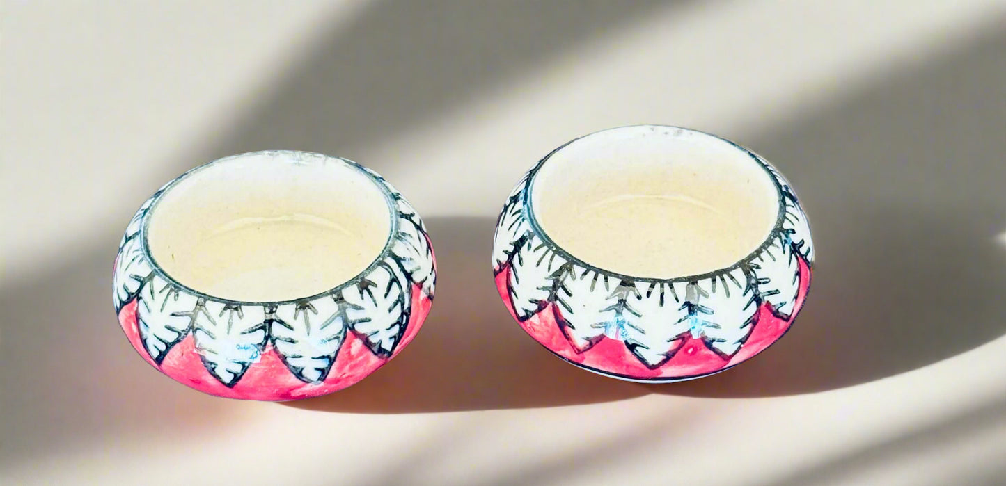 Handcrafted Jaipur Blue Pottery tea light holders, featuring intricate designs and vibrant blue hues, adding a traditional Indian touch to your home decor.