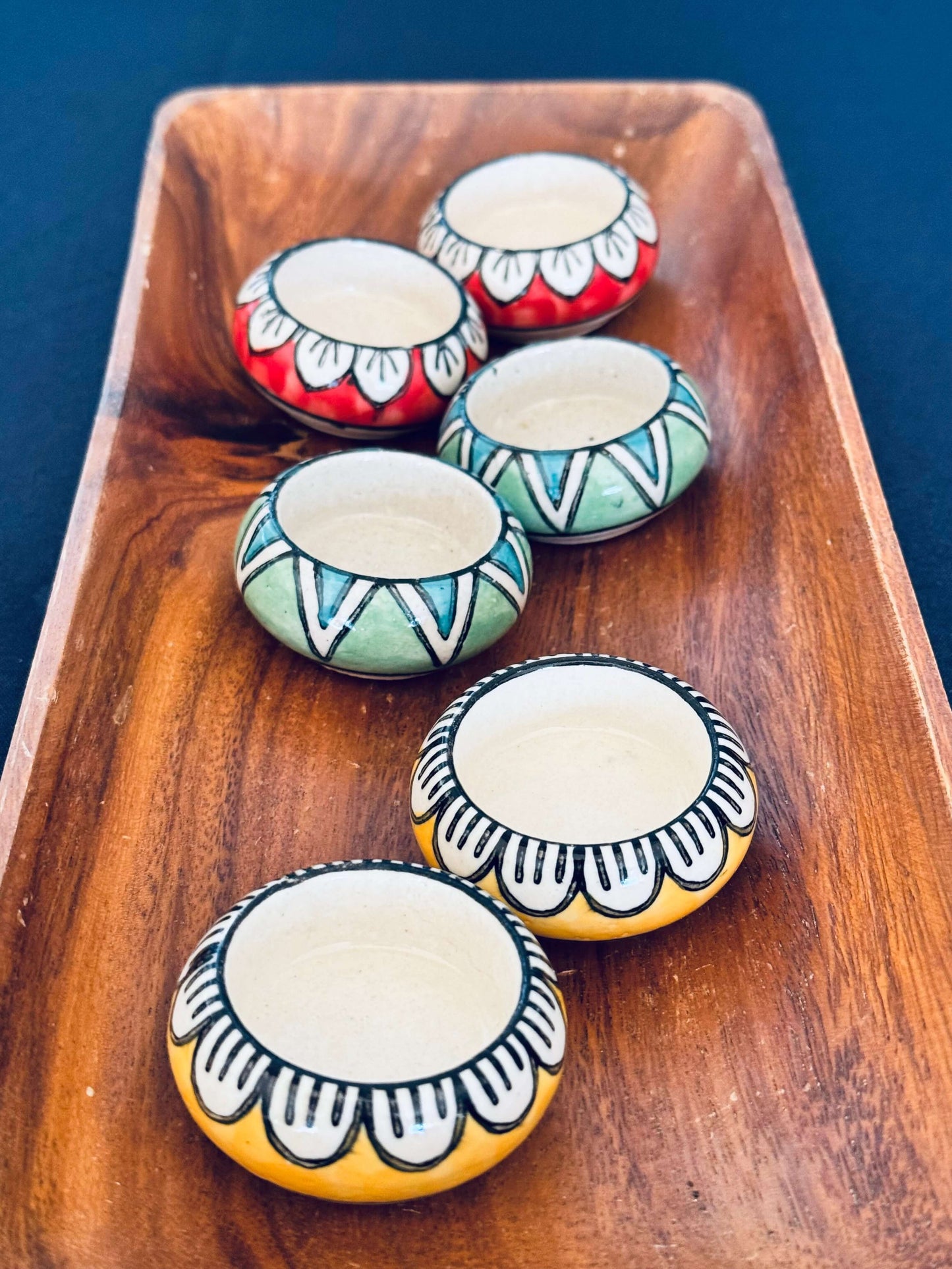 Handcrafted Jaipur Blue Pottery tea light holders, featuring intricate designs and vibrant blue hues, adding a traditional Indian touch to your home decor.